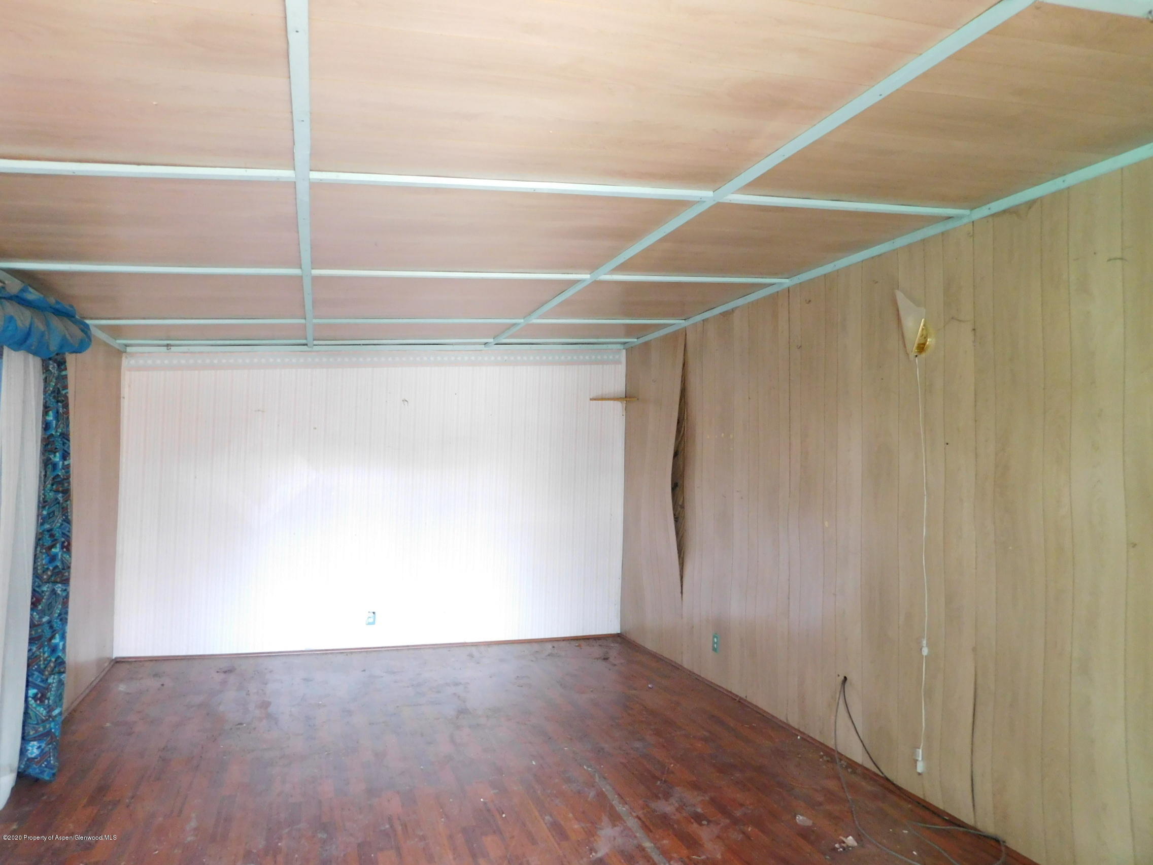 2235 Baker Drive Craig, CO 81625 - Photo 5 of 16 a view of a room with wooden floor and white walls