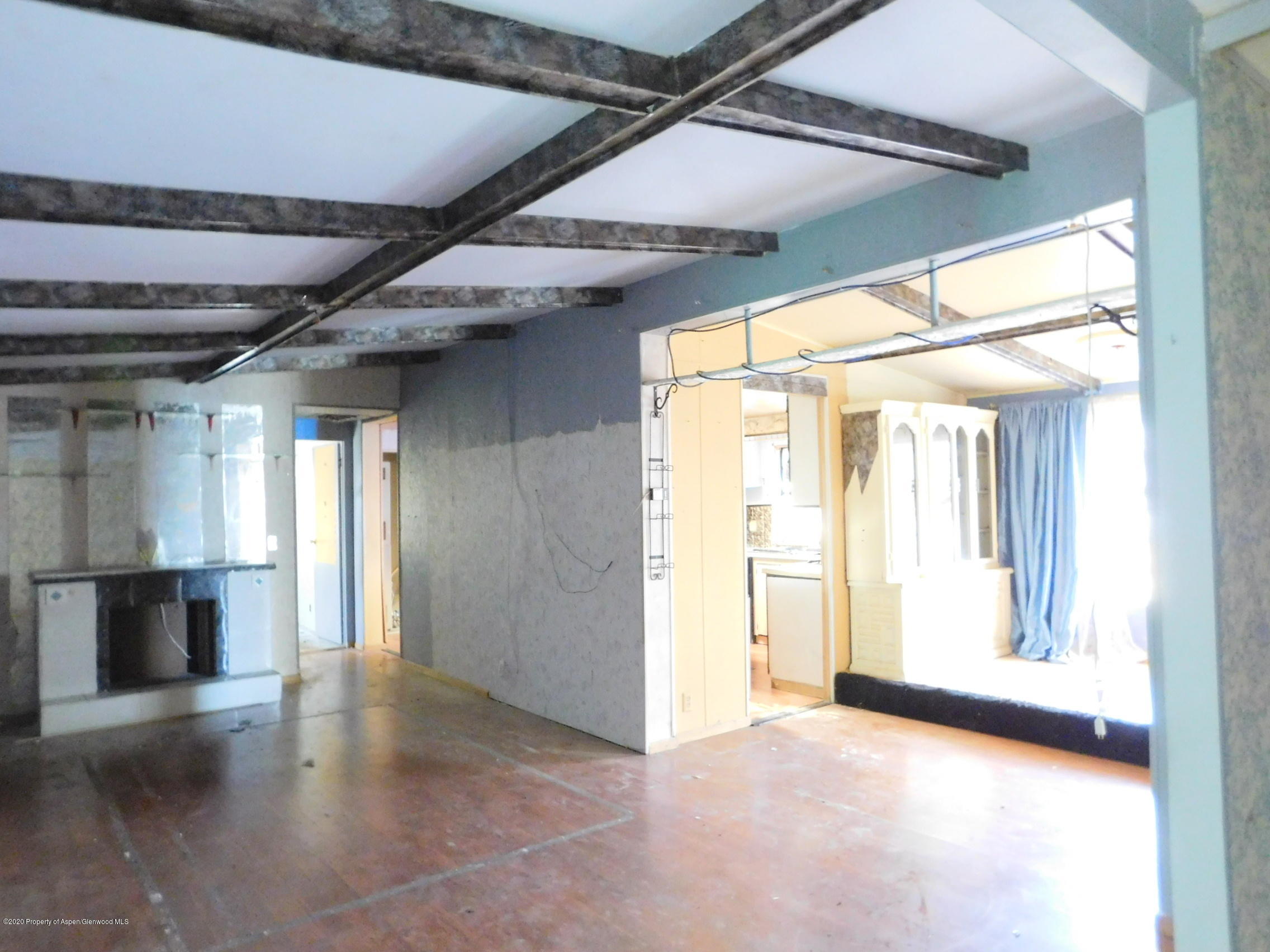 2235 Baker Drive Craig, CO 81625 - Photo 7 of 16 a view of empty room with wooden floor and floor to ceiling window