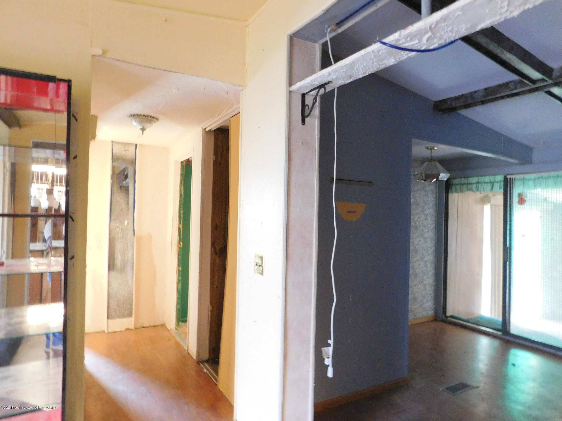2235 Baker Drive Craig, CO 81625 - Photo 10 of 16 a view of a hallway with wooden floor and windows