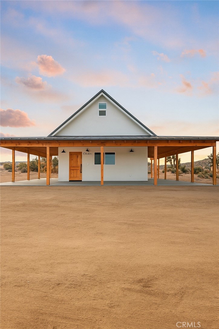 a front view of a house with large windows