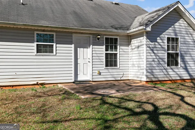 a backyard of a house with garage