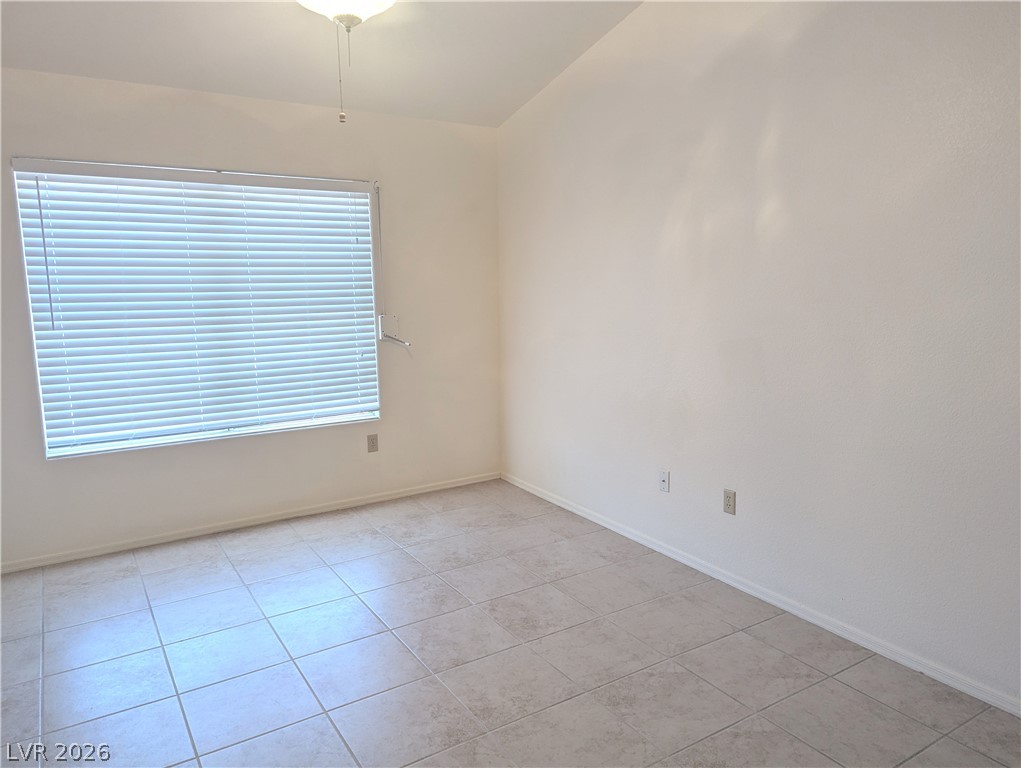 9433 Quail Ridge Drive Las Vegas, NV 89134 - Photo 4 of 23 A well-lit room featuring durable tile flooring and abundant natural illumination.