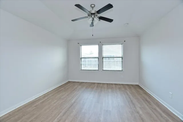 a view of a kitchen with microwave and cabinets