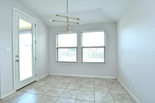 a kitchen with granite countertop a sink and a stove