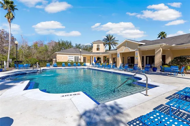 a view of a patio with swimming pool