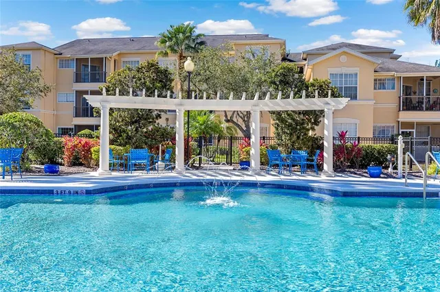a view of a house with a yard and sitting area