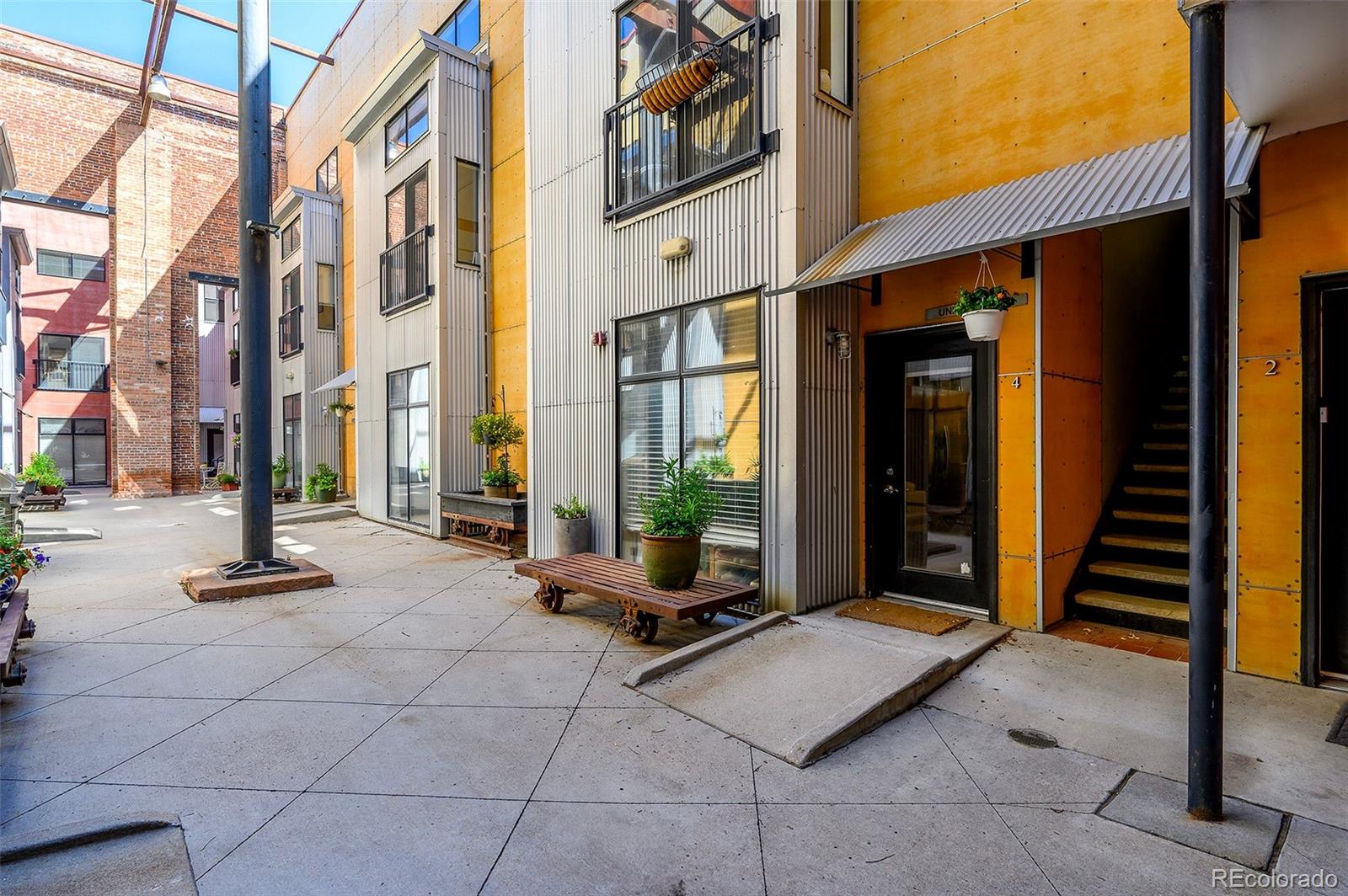 3225 Blake Street, Unit 4 Denver, CO 80205 - Photo 15 of 23 a view of a path with seating area