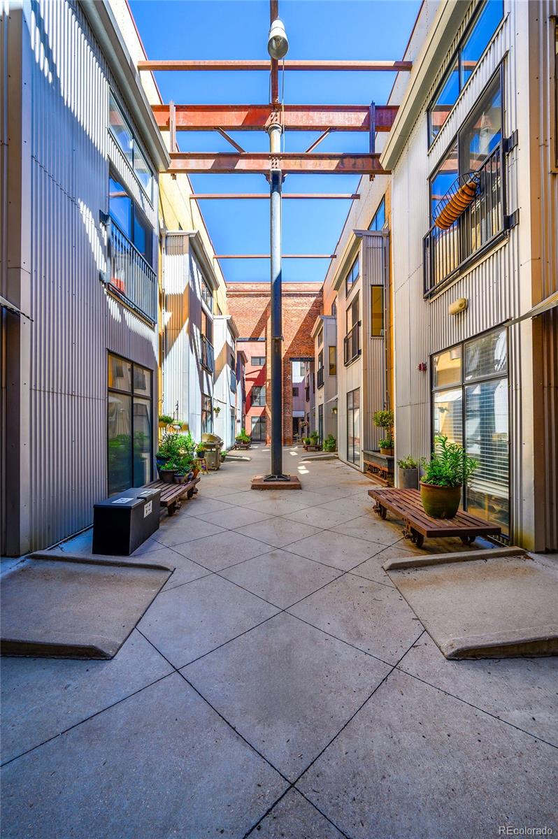 3225 Blake Street, Unit 4 Denver, CO 80205 - Photo 17 of 23 a view of a building with a couch