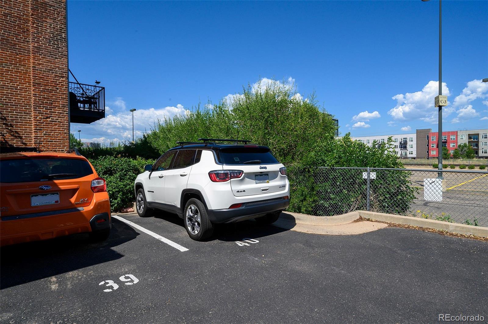 3225 Blake Street, Unit 4 Denver, CO 80205 - Photo 18 of 23 a front view of a house with a yard