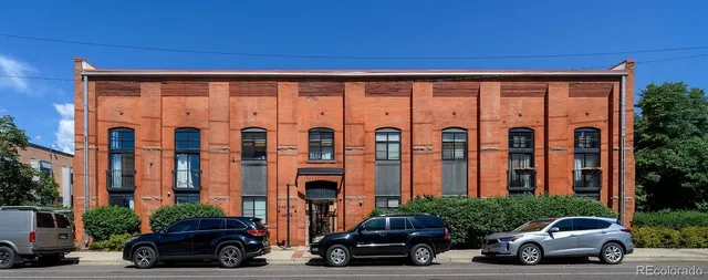 a view of swimming pool with outdoor seating and plants