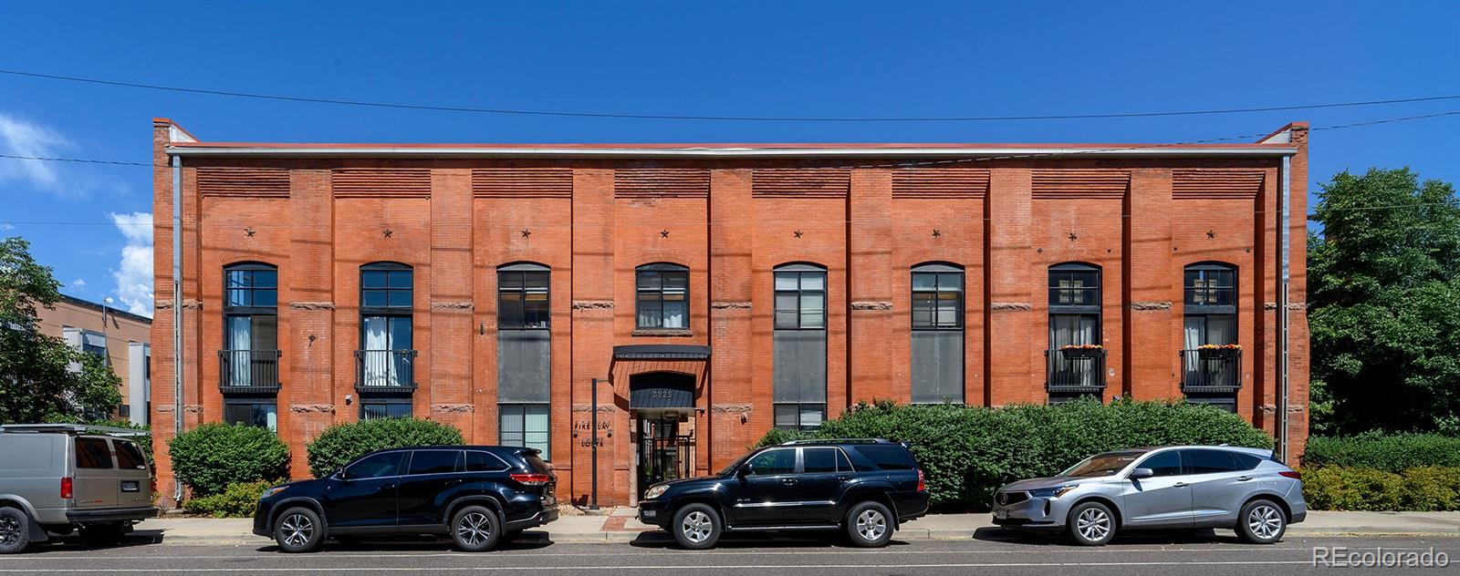 3225 Blake Street, Unit 4 Denver, CO 80205 - Photo 19 of 23 a car parked in front of a building