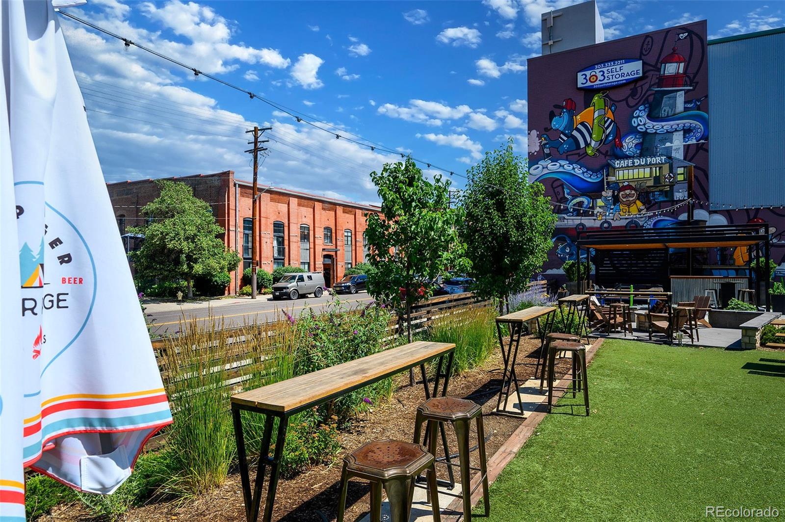 3225 Blake Street, Unit 4 Denver, CO 80205 - Photo 20 of 23 a view of swimming pool with outdoor seating and plants