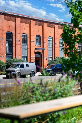 a view of a patio with table and chairs and potted plants