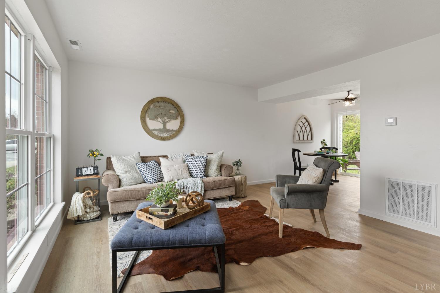 178 Dulwich Drive, Unit 182 Amherst, VA 24521 - Photo 4 of 23 a living room with furniture and a wooden floor