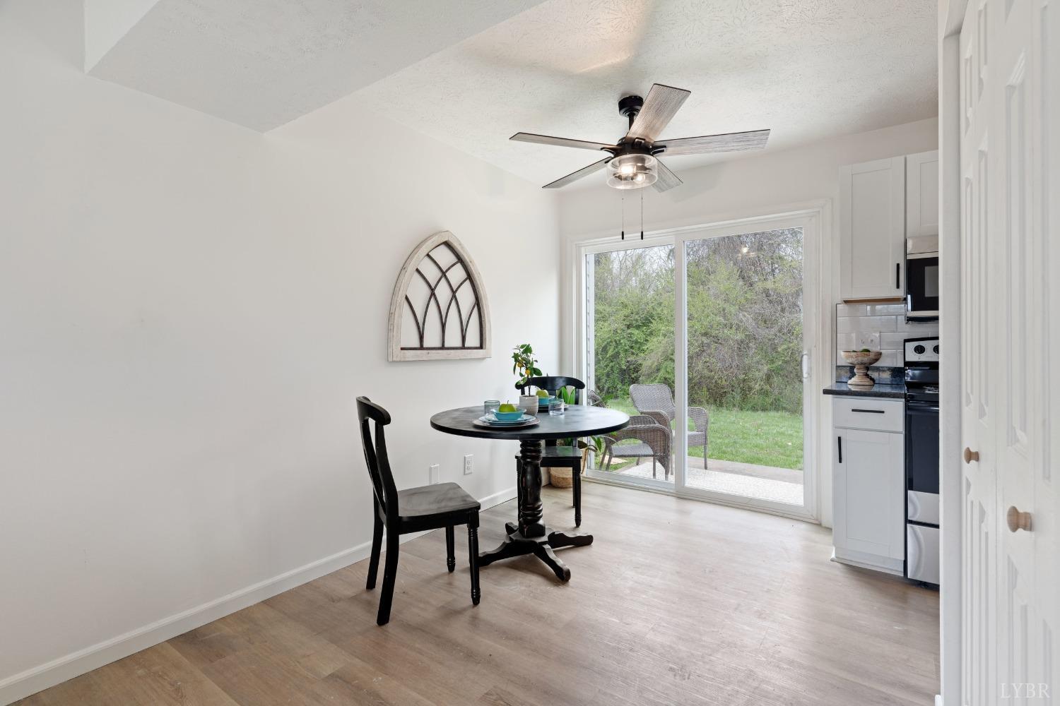 178 Dulwich Drive, Unit 182 Amherst, VA 24521 - Photo 8 of 23 a view of a dining room with furniture window and wooden floor