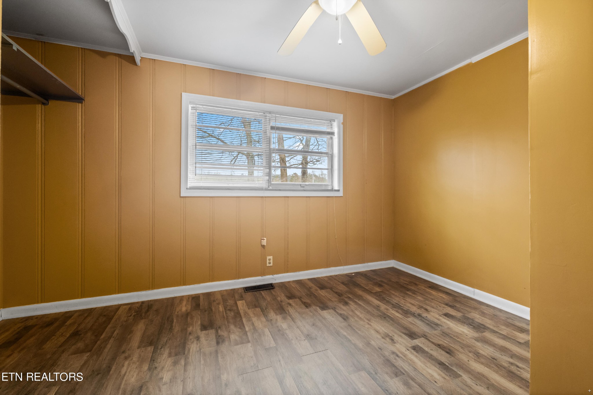 738 South Jackson Street Athens, TN 37303 - Photo 11 of 25 a view of an empty room with wooden floor and a window