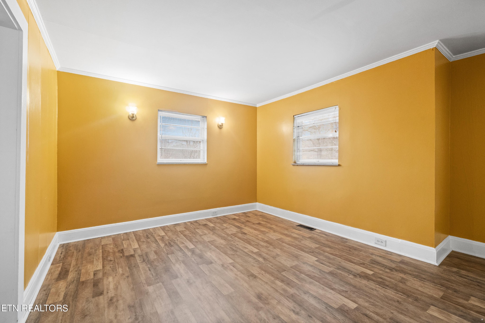 738 South Jackson Street Athens, TN 37303 - Photo 17 of 25 a view of an empty room with wooden floor and a window