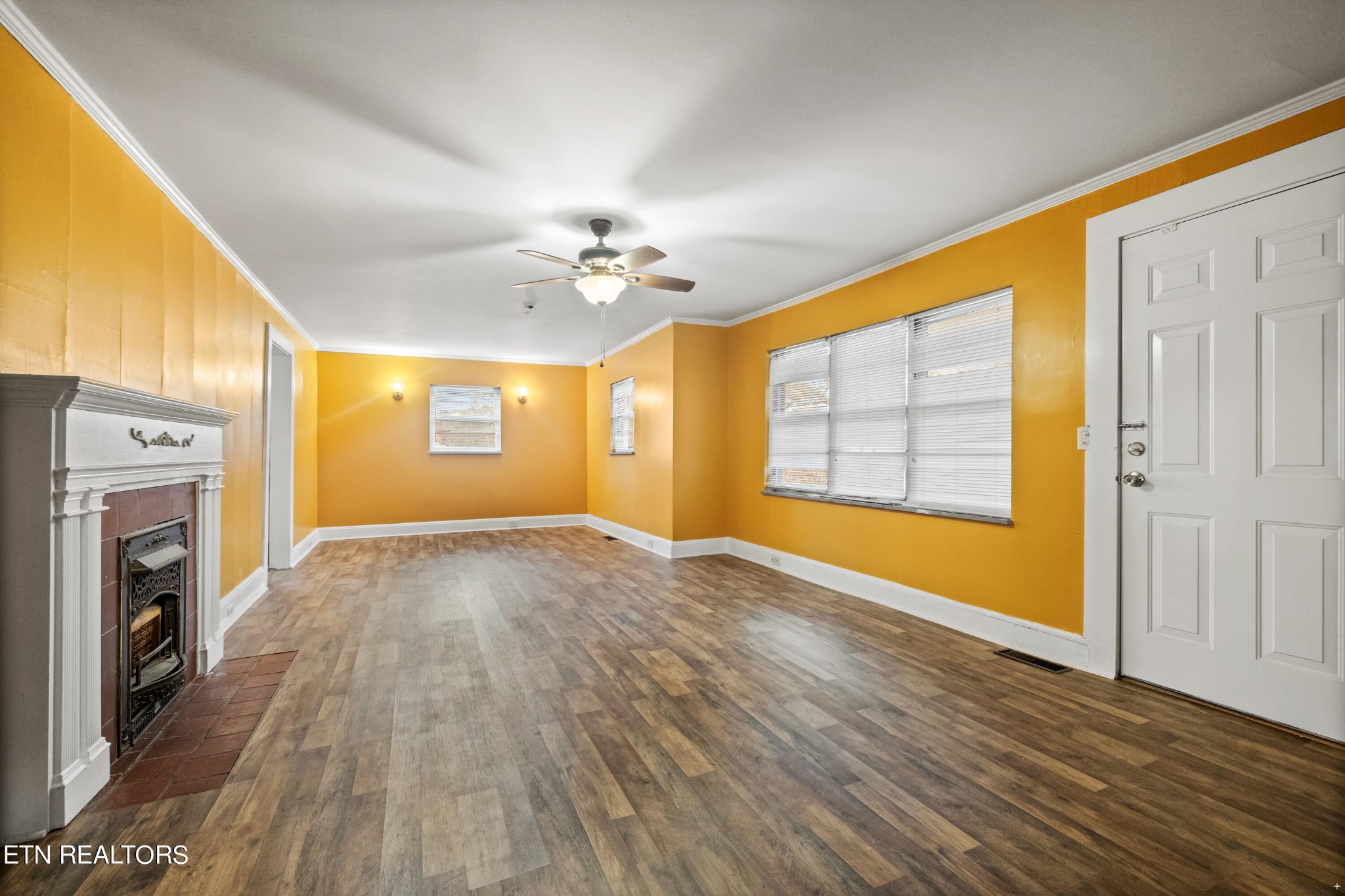 738 South Jackson Street Athens, TN 37303 - Photo 22 of 25 a view of empty room with a fireplace and wooden floor