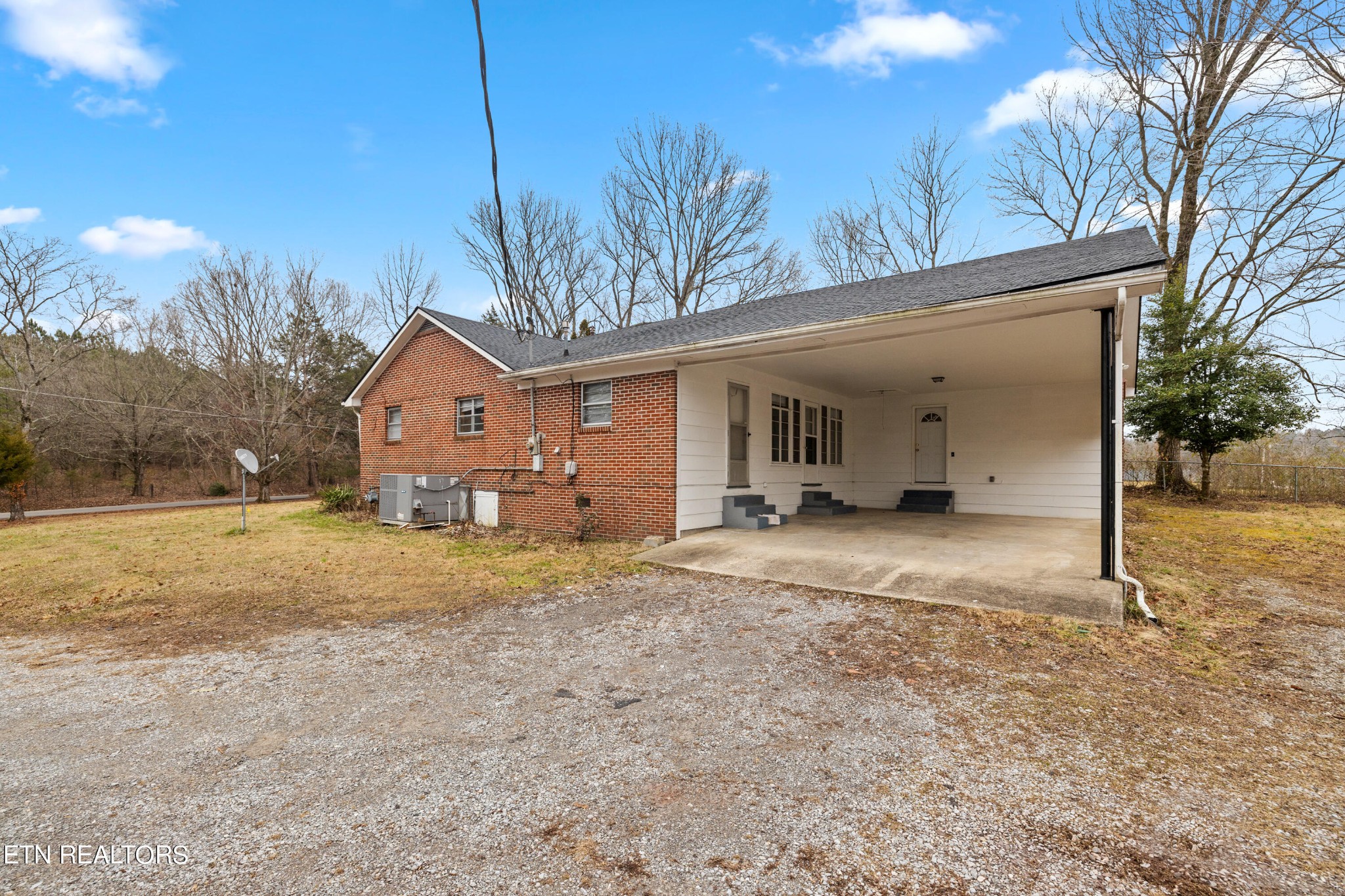 738 South Jackson Street Athens, TN 37303 - Photo 24 of 25 a view of a house with a yard and garage