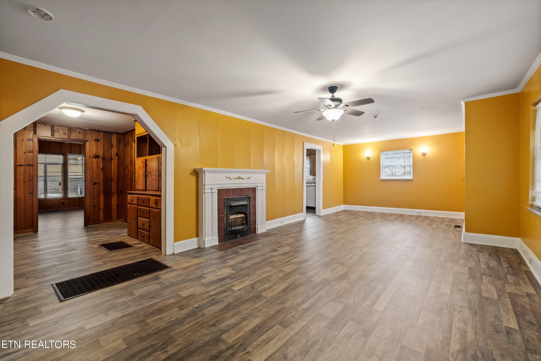 738 South Jackson Street Athens, TN 37303 - Photo 5 of 25 a view of livingroom and fireplace with wooden floor