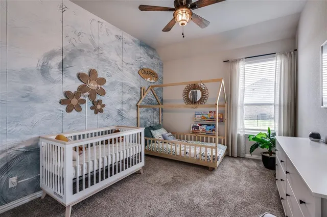 a view of a bedroom with wooden bed
