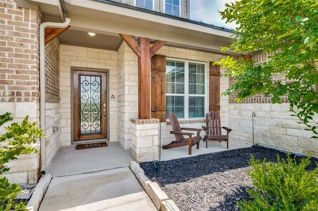 a front view of house with outdoor space and swimming pool