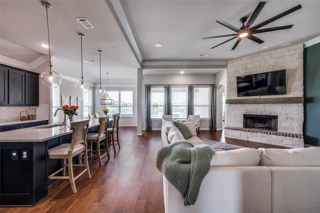 a view of a hallway with wooden floor and front door