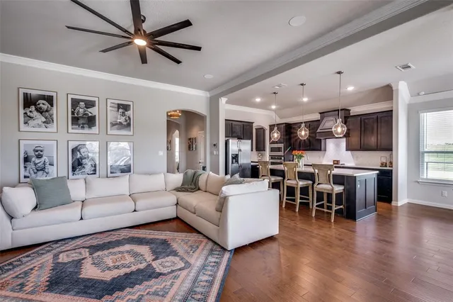 a living room with furniture fireplace and a flat screen tv