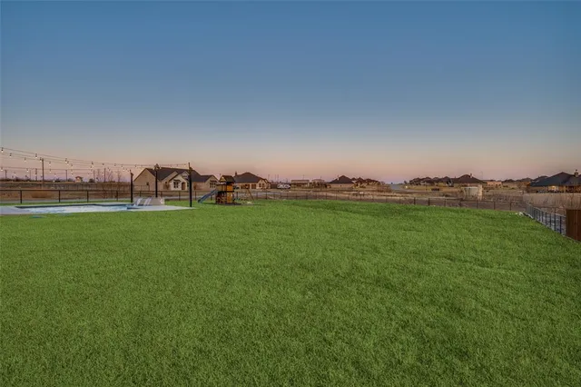 a view of a golf course with a lake