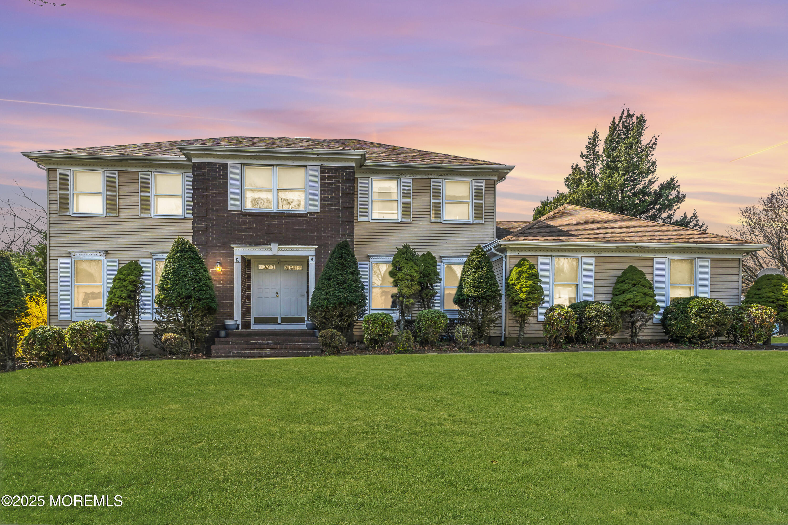 24 Laird Road Middletown, NJ 07748 - Photo 1 of 45 a front view of a house with a yard and trees