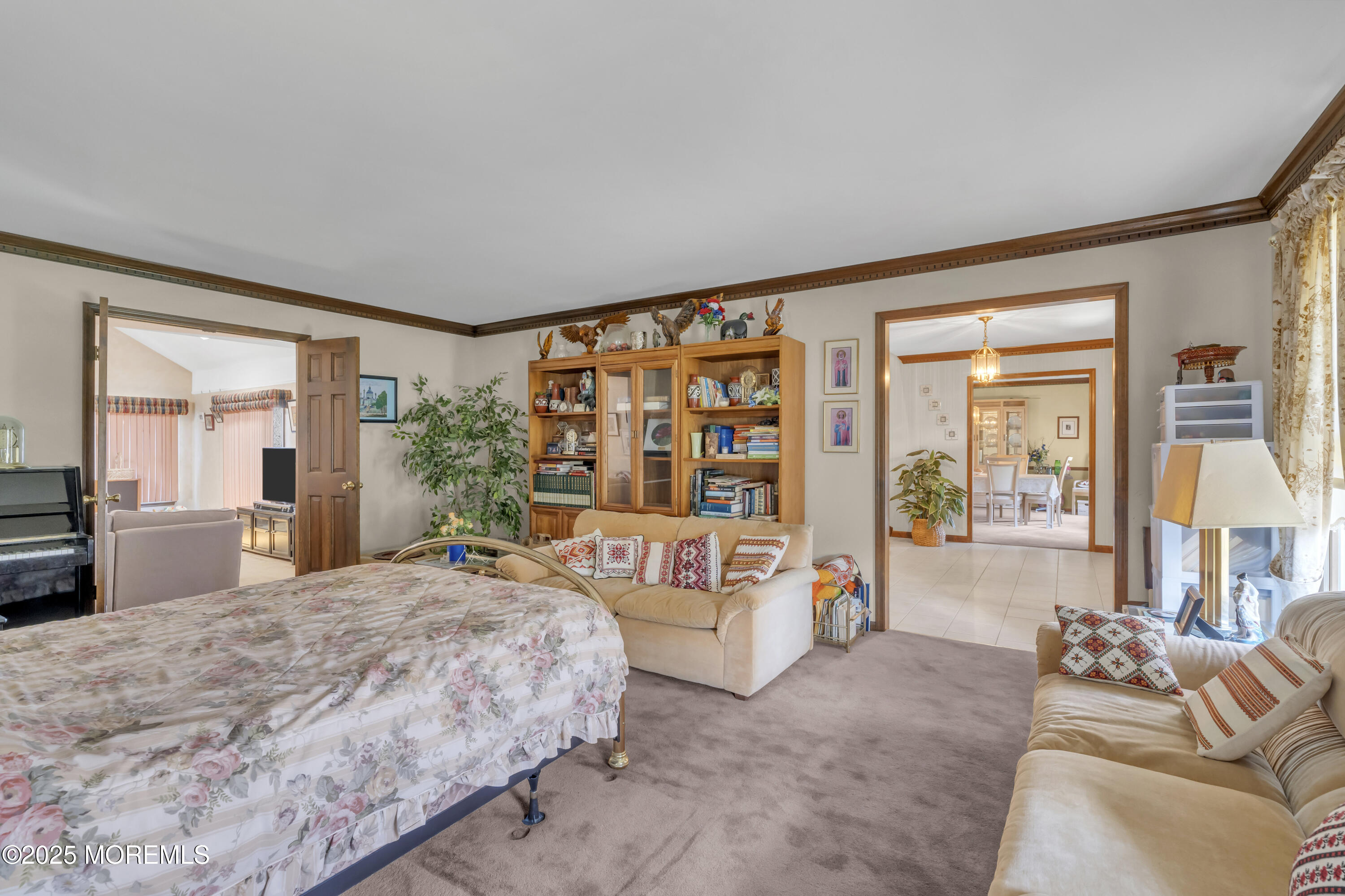 24 Laird Road Middletown, NJ 07748 - Photo 12 of 45 a bedroom with a large bed and a large window