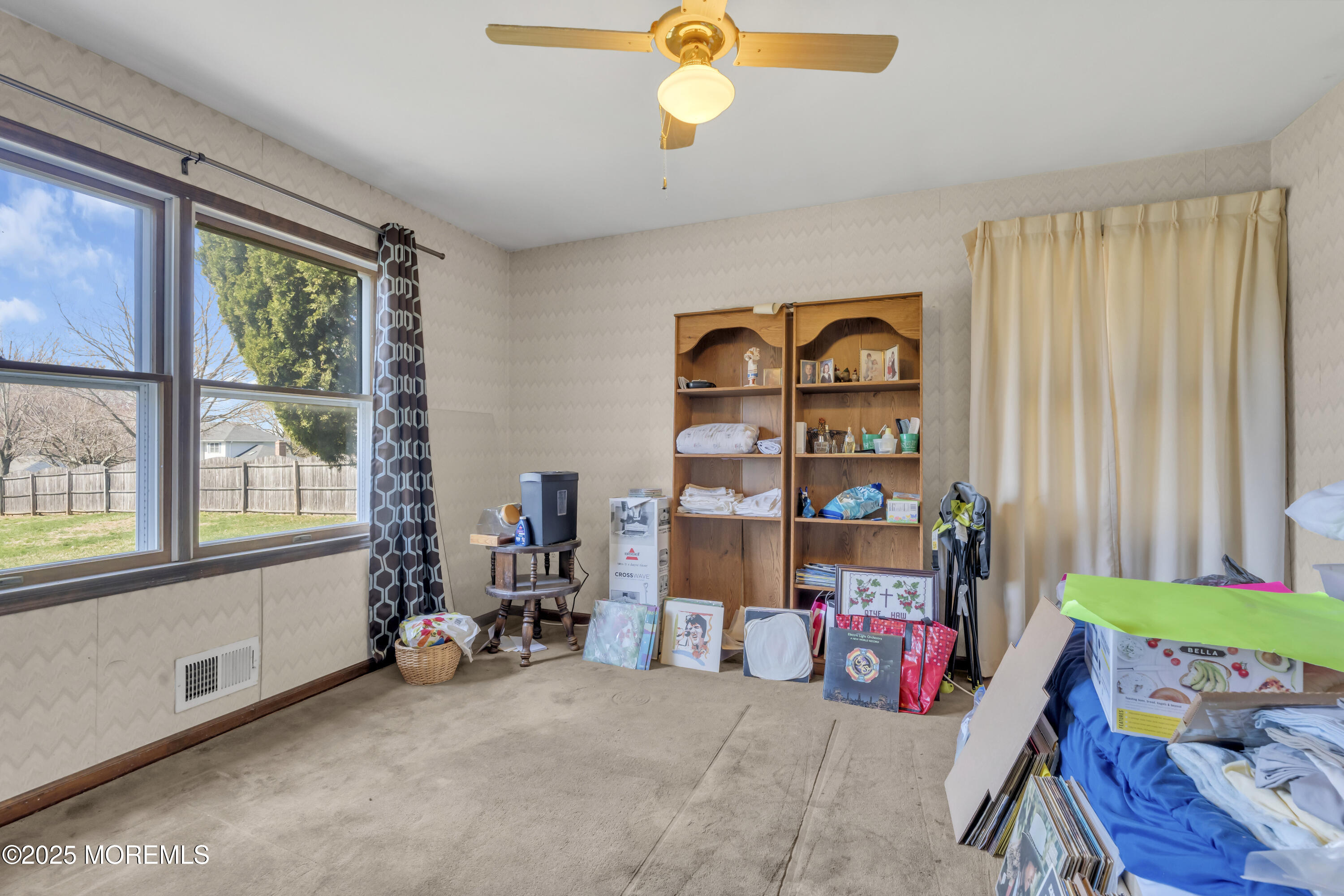 24 Laird Road Middletown, NJ 07748 - Photo 15 of 45 a living room with baby crib furniture and a window
