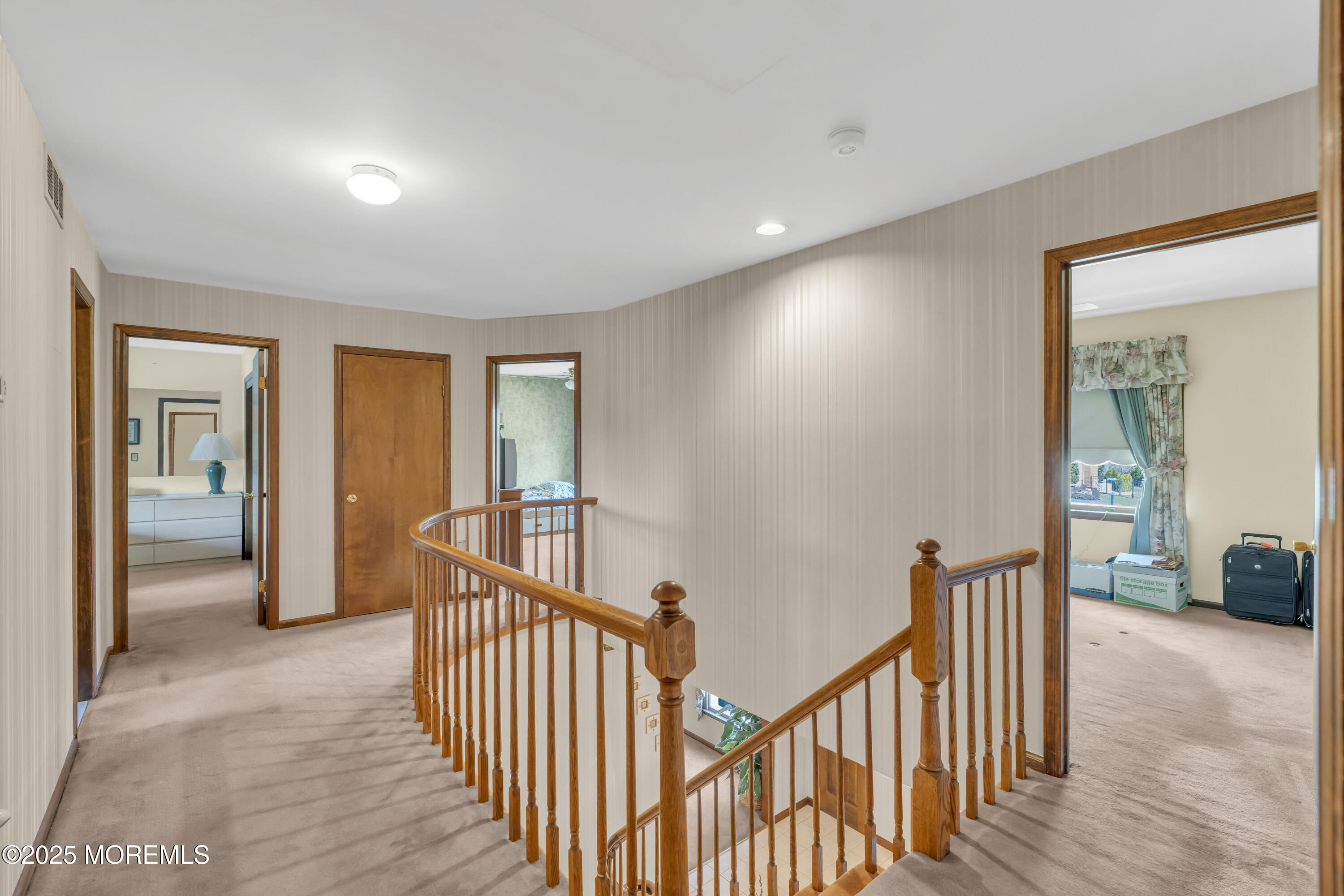 24 Laird Road Middletown, NJ 07748 - Photo 19 of 45 a view of a hallway with wooden floor and windows