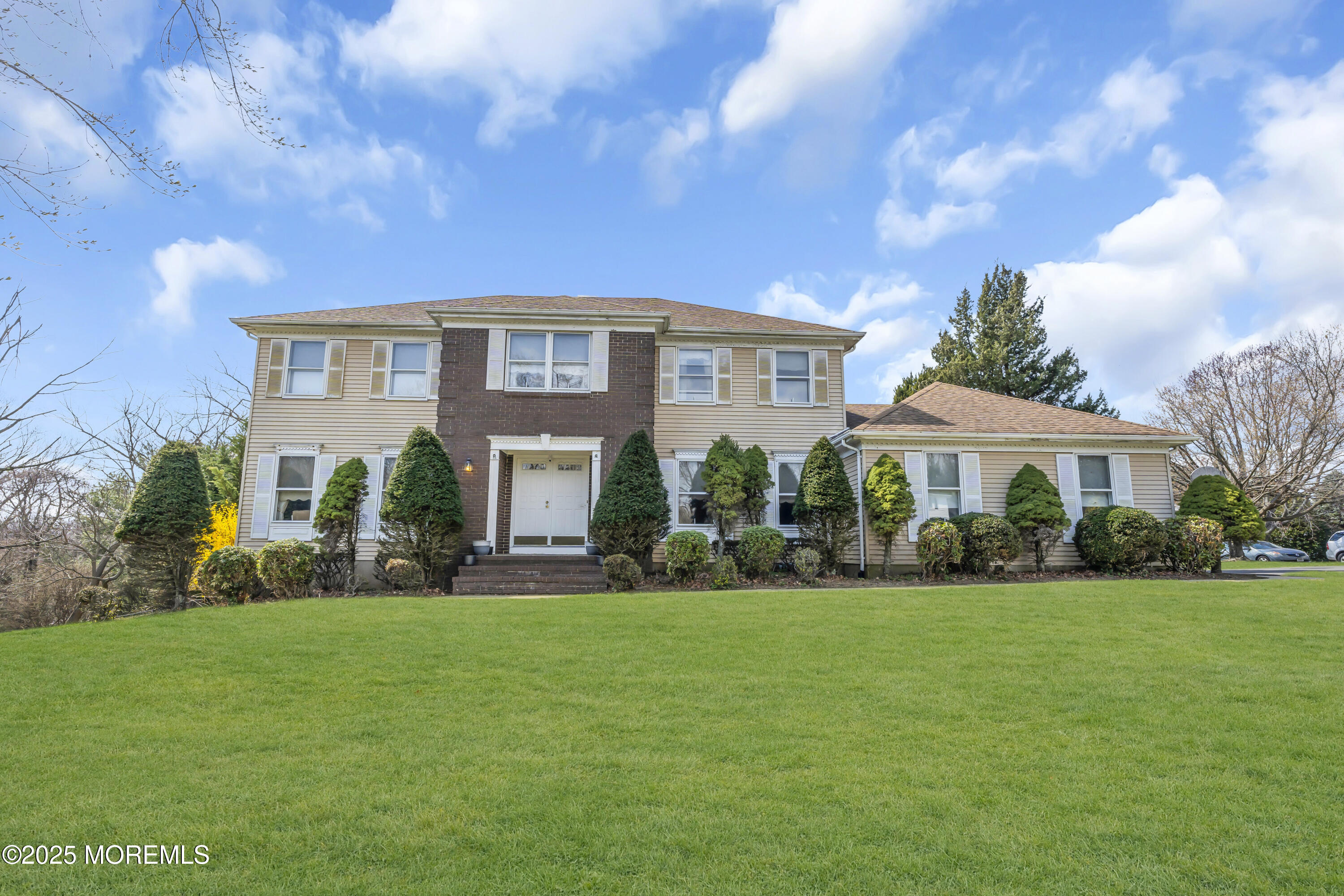 24 Laird Road Middletown, NJ 07748 - Photo 2 of 45 a front view of a house with a yard