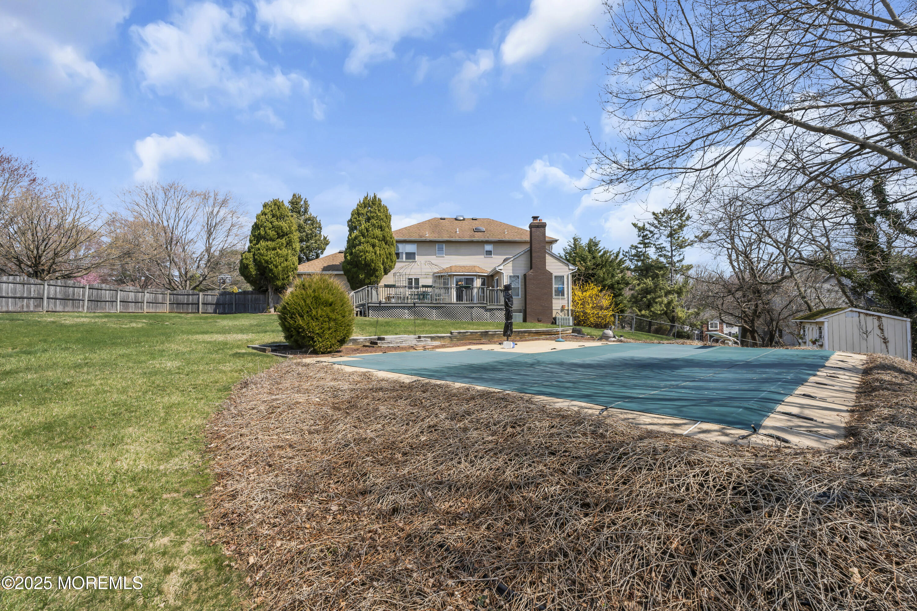 24 Laird Road Middletown, NJ 07748 - Photo 45 of 45 a front view of a house with a yard and large trees