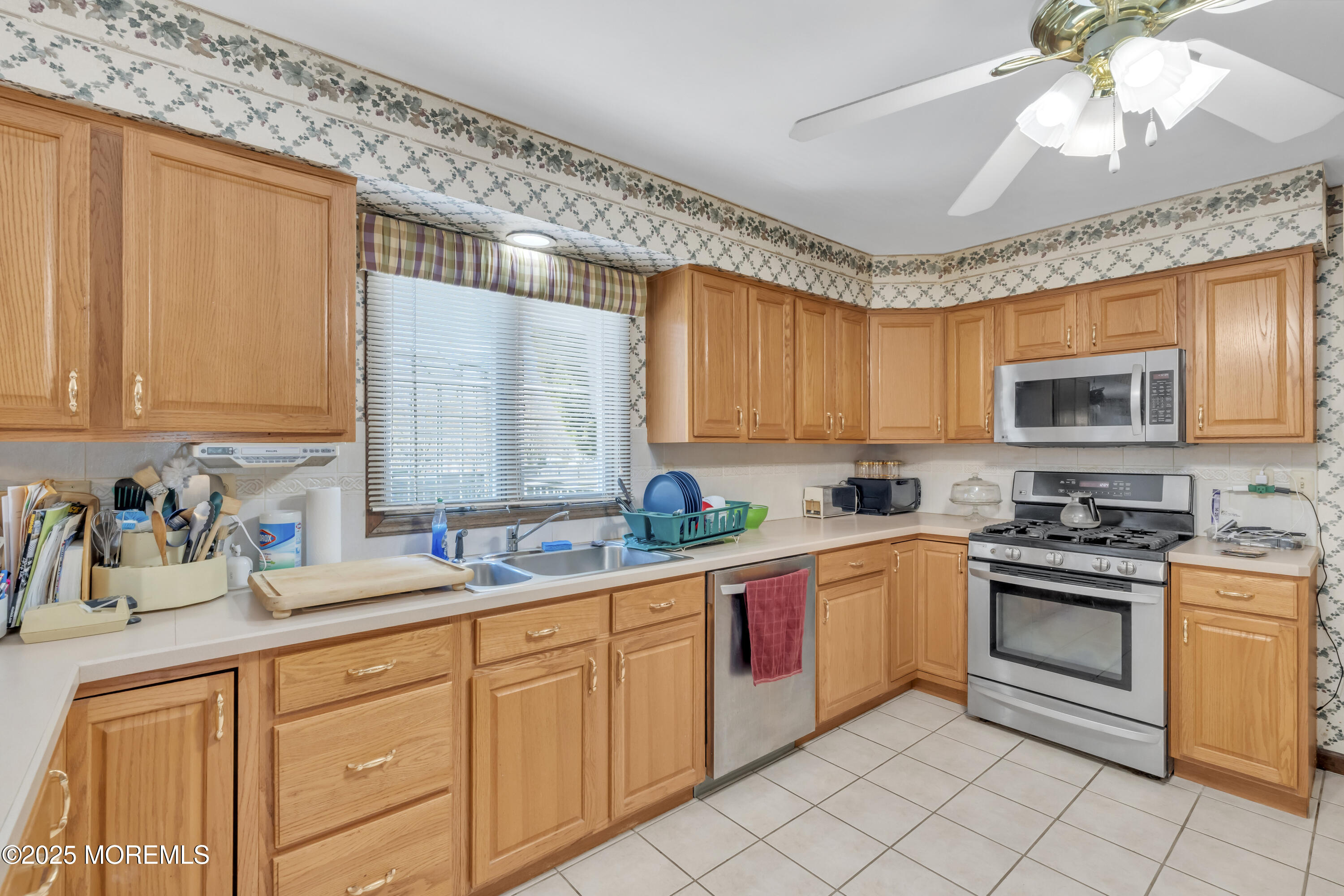 24 Laird Road Middletown, NJ 07748 - Photo 7 of 45 a kitchen with stainless steel appliances granite countertop a sink window and cabinets