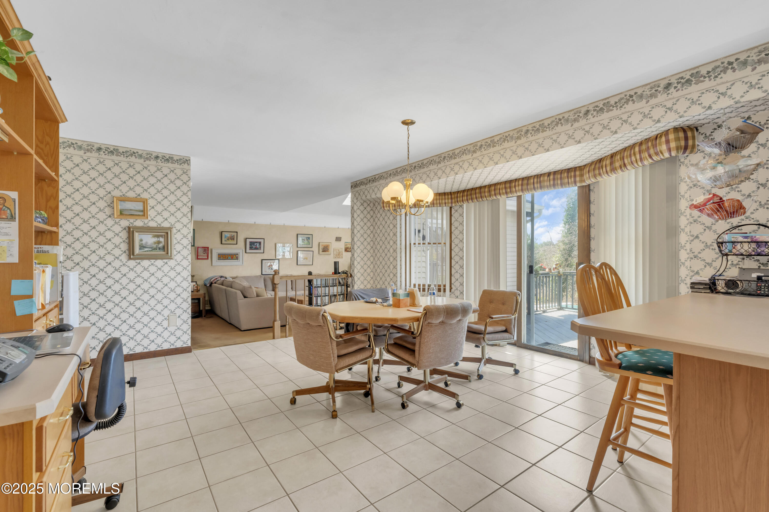 24 Laird Road Middletown, NJ 07748 - Photo 8 of 45 a living room with patio furniture and a large window