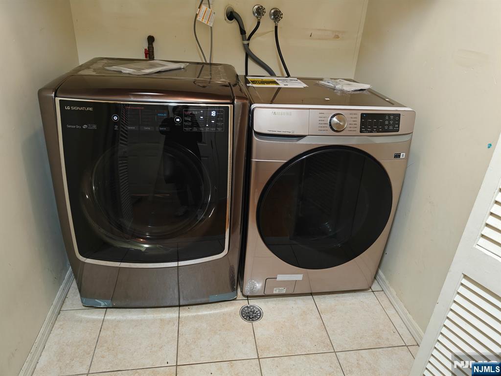 755 Edgewater Avenue, Unit 2 Ridgefield, NJ 07657 - Photo 12 of 13 a close up view of a washer and dryer