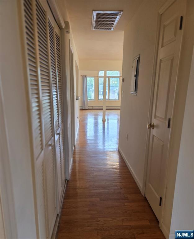 755 Edgewater Avenue, Unit 2 Ridgefield, NJ 07657 - Photo 13 of 13 a view of a hallway with wooden floor and stairs