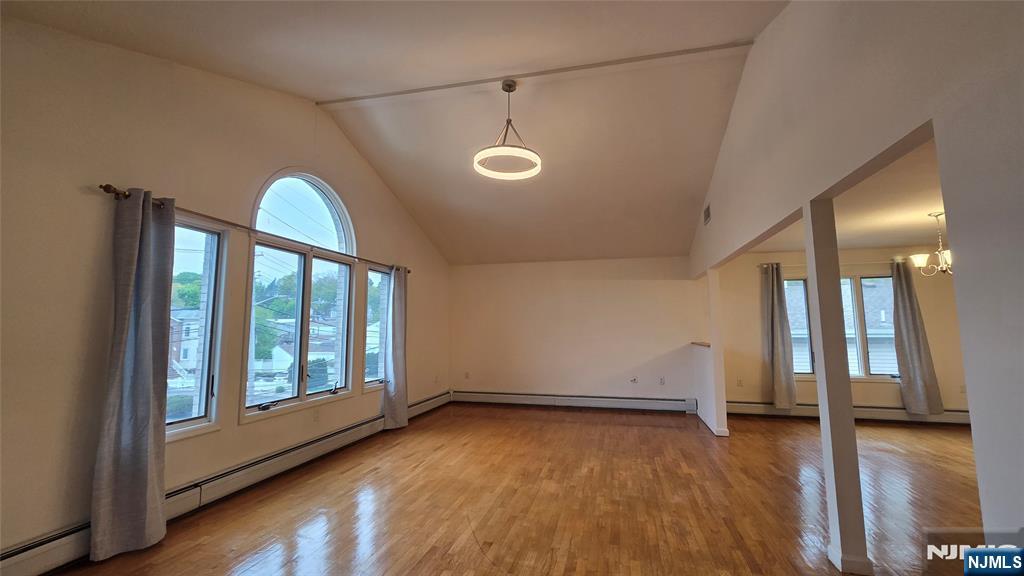755 Edgewater Avenue, Unit 2 Ridgefield, NJ 07657 - Photo 3 of 13 wooden floor in an empty room with a window