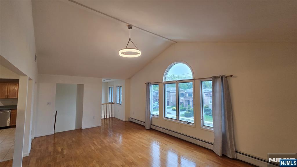 755 Edgewater Avenue, Unit 2 Ridgefield, NJ 07657 - Photo 4 of 13 a view of empty room with wooden floor and fan