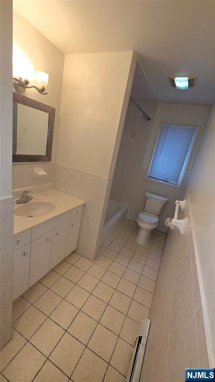 755 Edgewater Avenue, Unit 2 Ridgefield, NJ 07657 - Photo 7 of 13 a bathroom with a sink a toilet and mirror