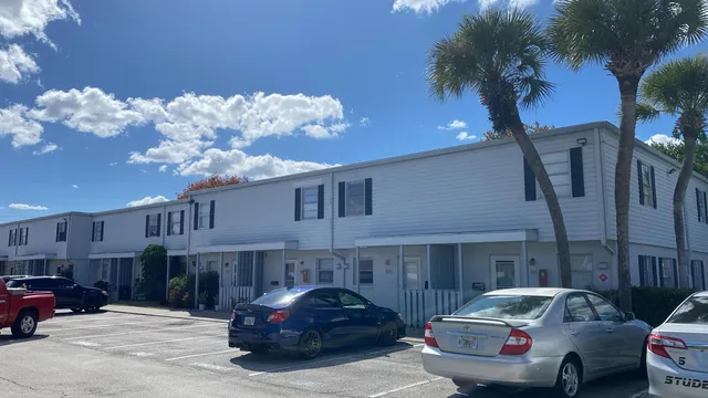 a front view of a house with parking space