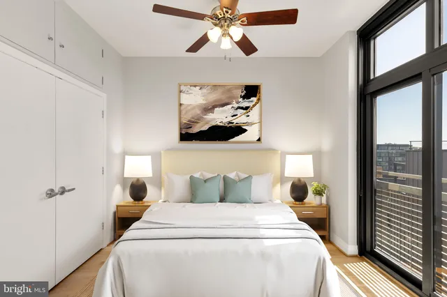 a bedroom with a bed and a chandelier