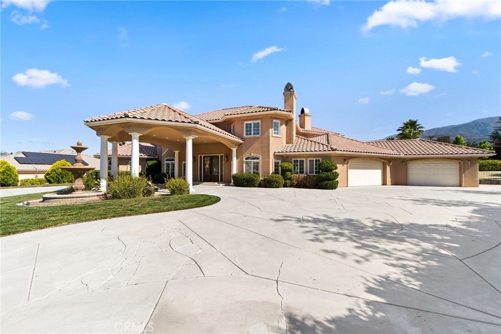 38136 Butterfly Court Yucaipa, CA 92399 - Photo 11 of 71 a front view of a house with a yard