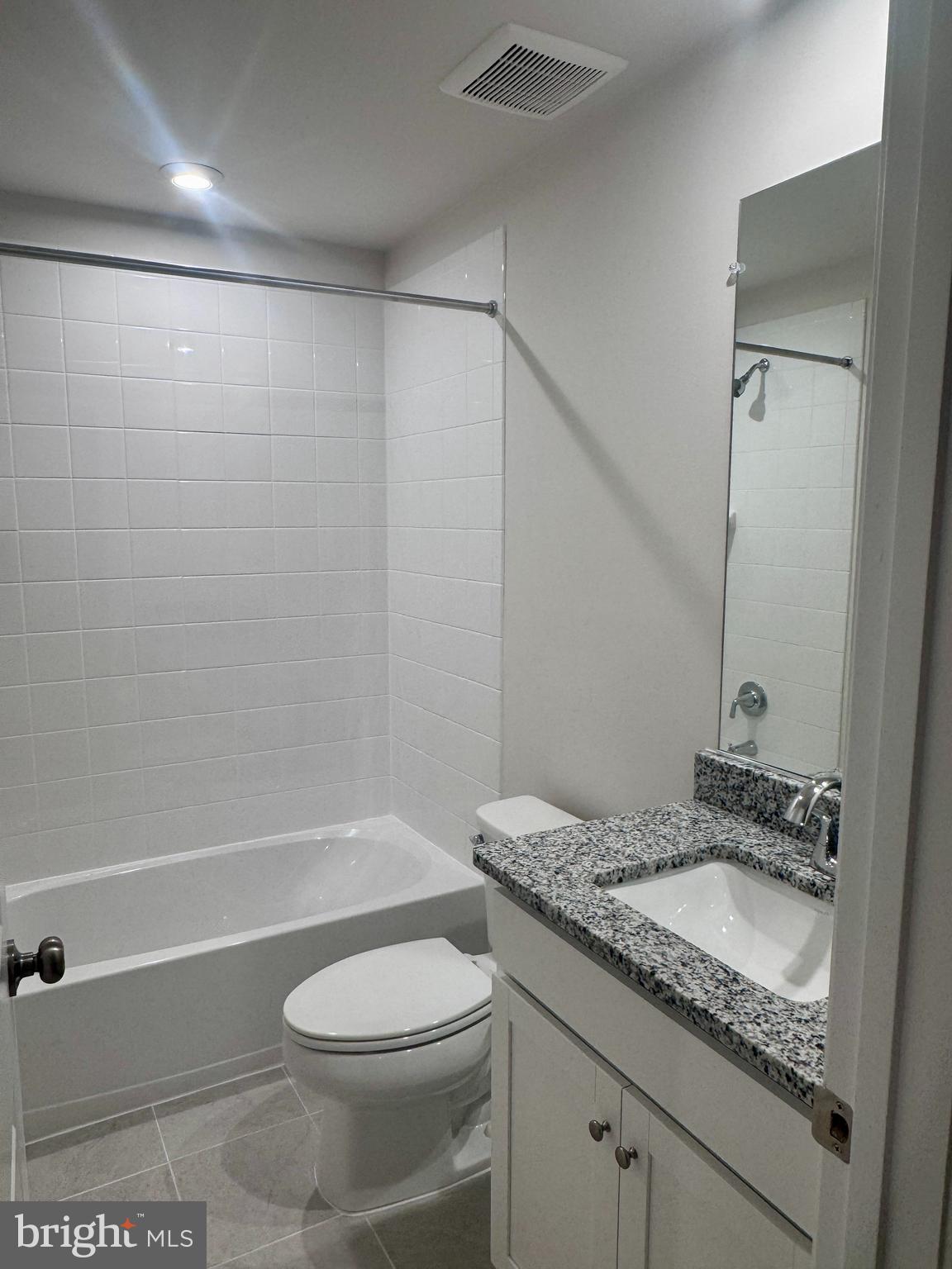 37 Taft Avenue Ranson, WV 25438 - Photo 15 of 18 a bathroom with a granite countertop sink toilet and shower