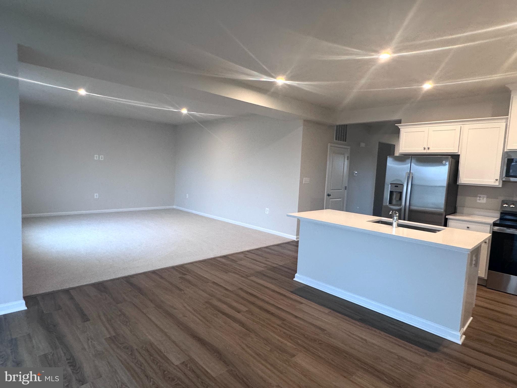 37 Taft Avenue Ranson, WV 25438 - Photo 5 of 18 a room with wooden floor and furniture