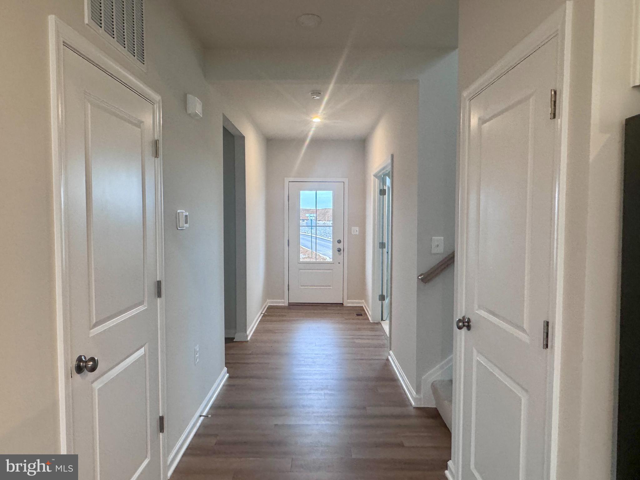 37 Taft Avenue Ranson, WV 25438 - Photo 7 of 18 a view of a hallway with wooden floor