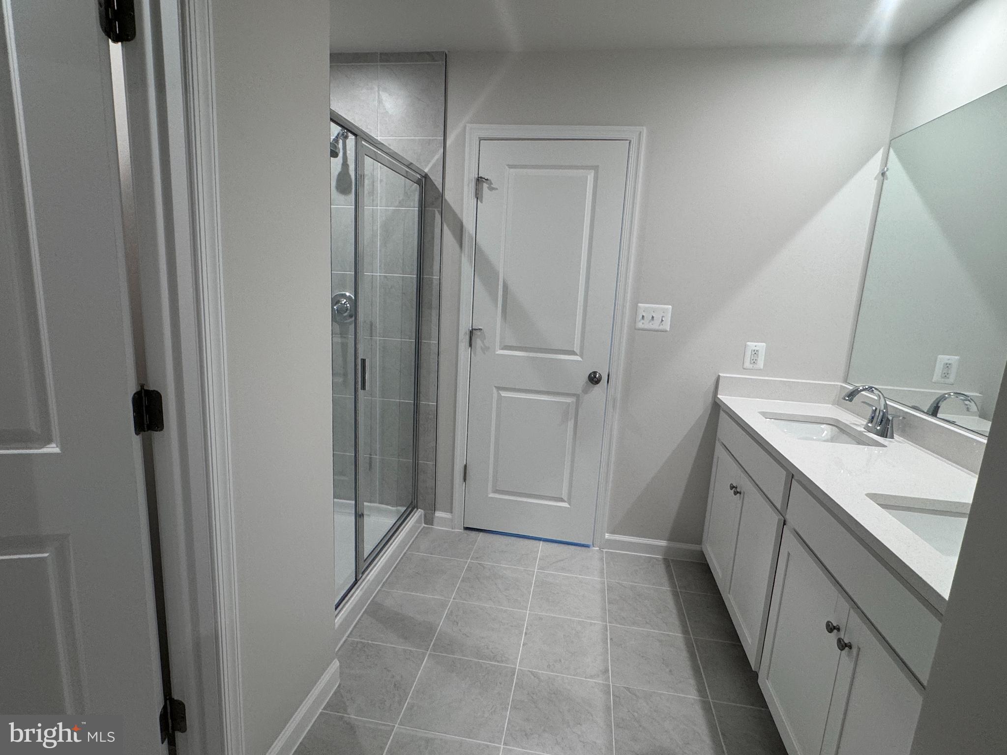 37 Taft Avenue Ranson, WV 25438 - Photo 9 of 18 a bathroom with a double vanity sink a toilet and a mirror
