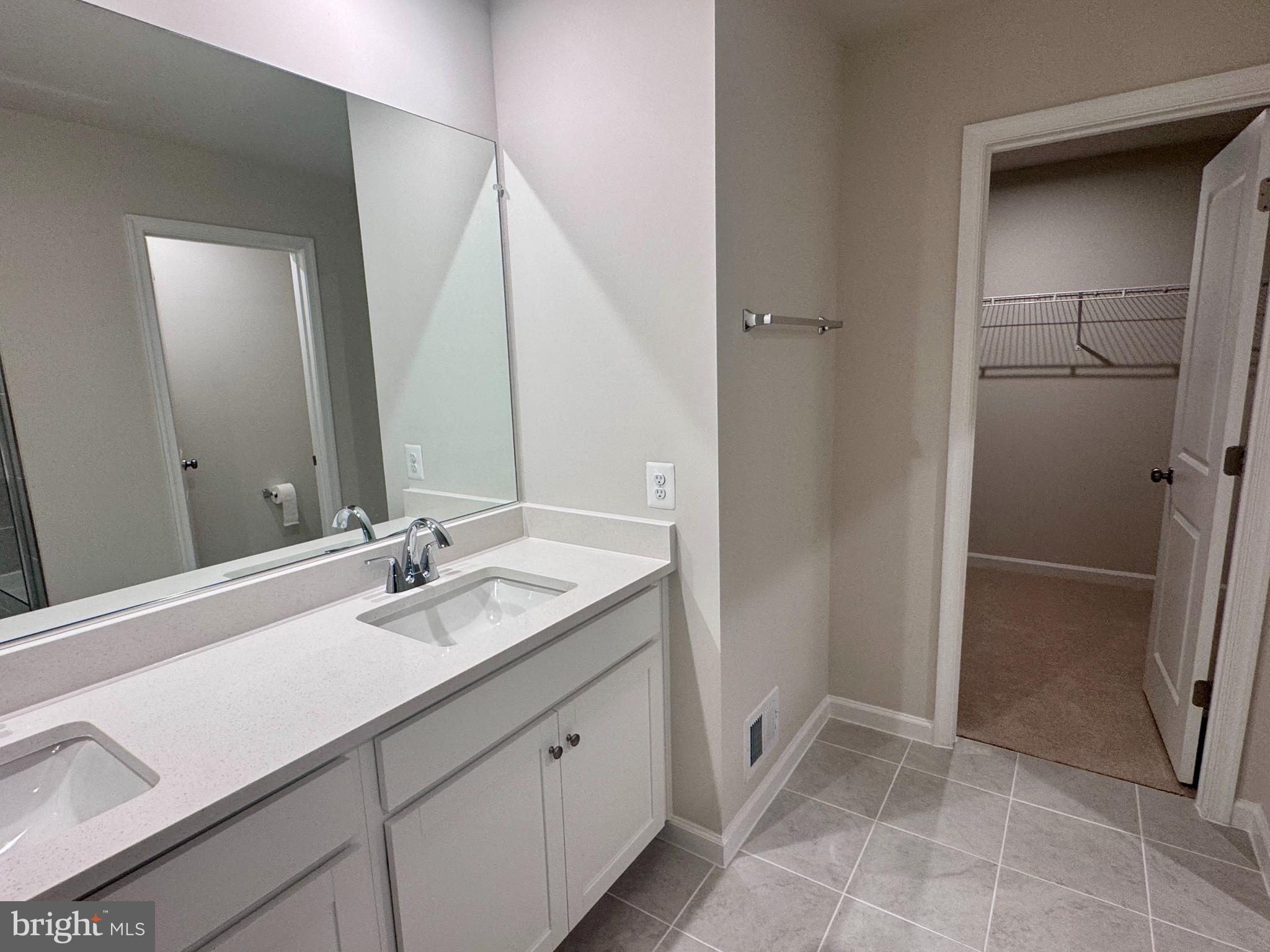 37 Taft Avenue Ranson, WV 25438 - Photo 10 of 18 a bathroom with a double vanity sink and mirror